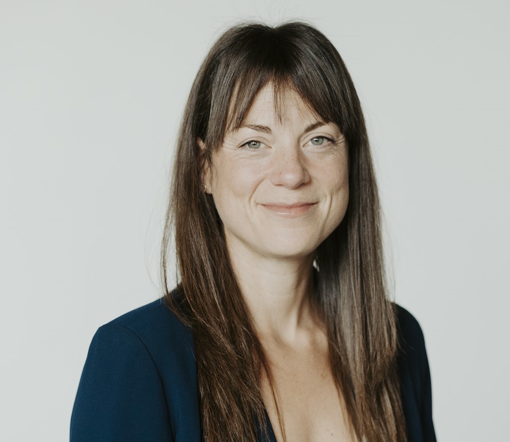 A woman posing for a professional profile picture