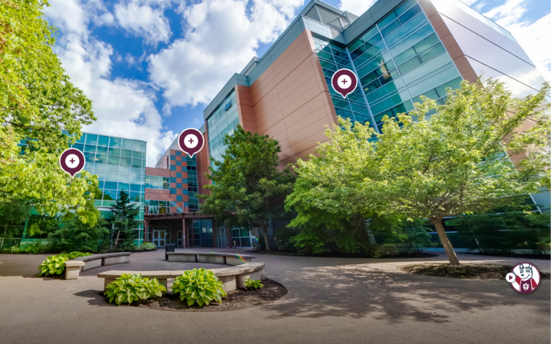 Screenshot of the virtual tour showing Science and Atrium exterior. Purple and white circles indicate tour stops.