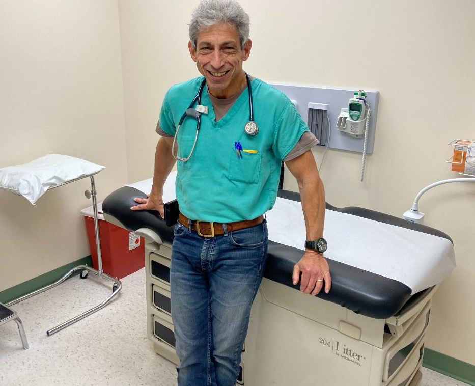 Dr. Gary Ernest stands in a doctors office.